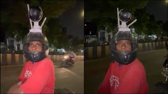 A man seen with a huge camera on his helmet. (Credit: X)